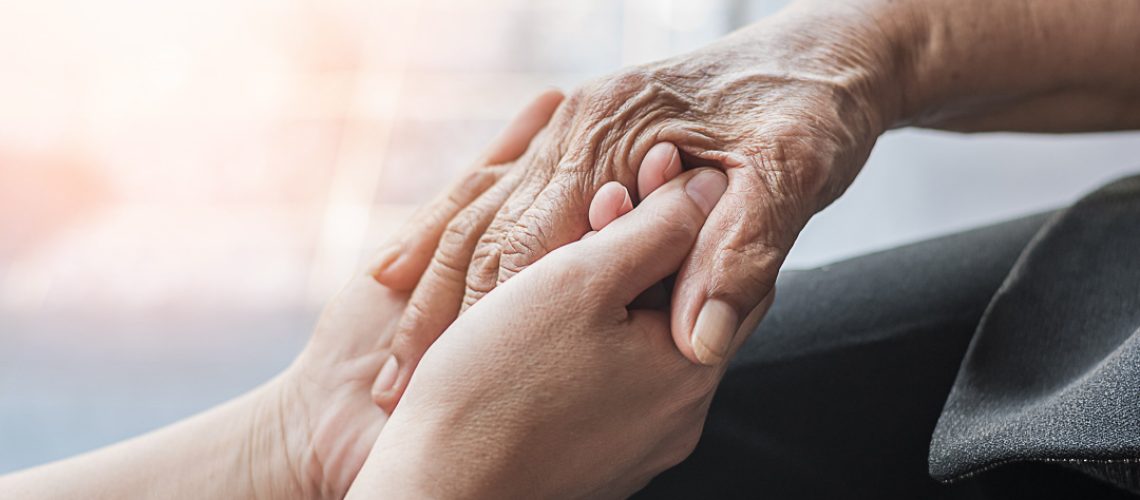 Parkinson disease patient, Alzheimer elderly senior, Arthritis person hand in support of nursing family caregiver care for disability awareness day, National care givers month, ageing society concept
