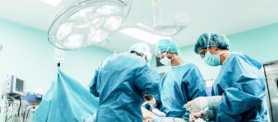 Team of Surgeons Operating in the Hospital.