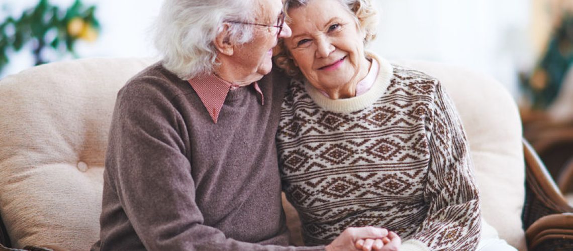 45607280 - happy senior man and woman having rest at home